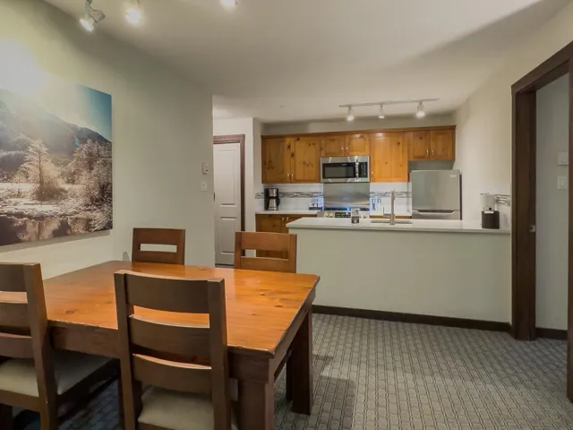 Dining area featuring track lighting