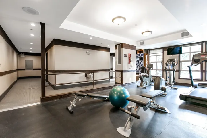 Exercise room featuring recessed lighting