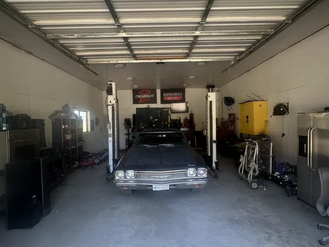 Garage with stainless steel fridge with ice dispenser
