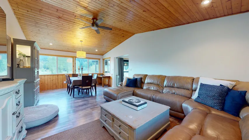 Living room with recessed lighting, wood ceiling, light wood-style floors, vaulted ceiling, and a ceiling fan