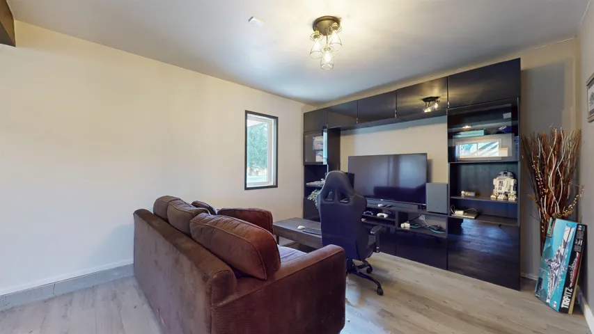 Office space with light wood-style flooring and baseboards