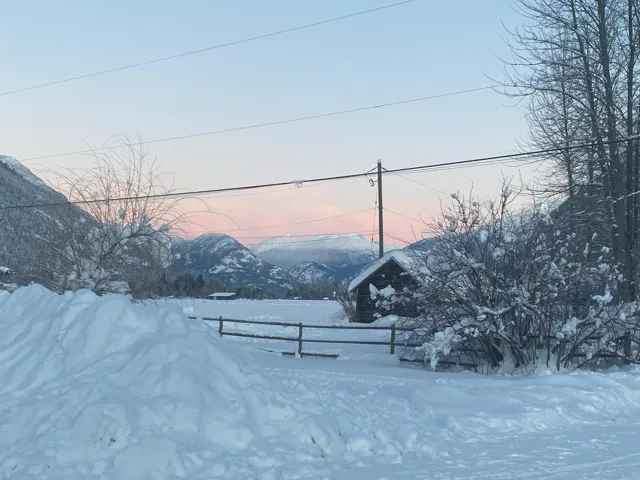 View of community with fence and a mountain view