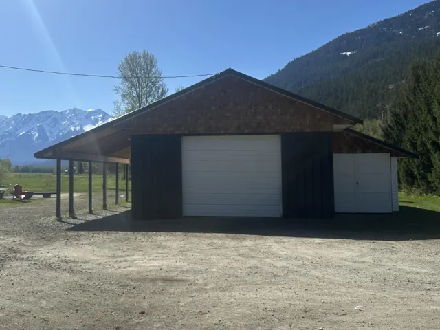 Garage featuring a mountain view and a garage