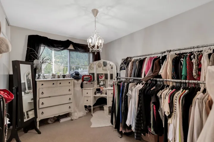 Room with neutral wall paint and carpeted flooring