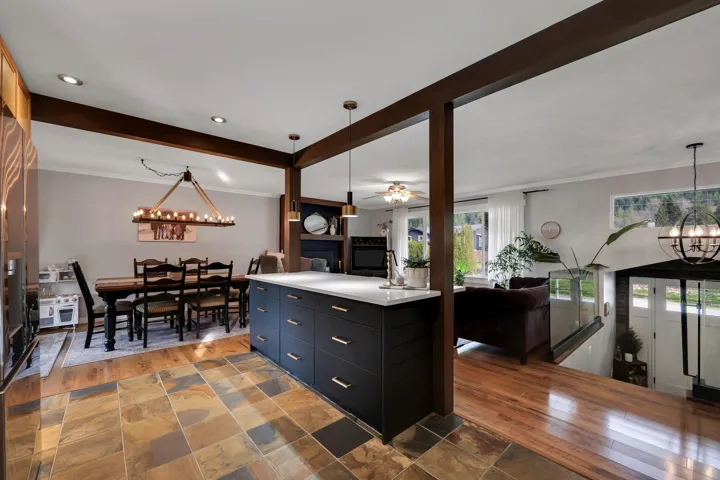 Expansive kitchen island with dark cabinetry and light countertop
