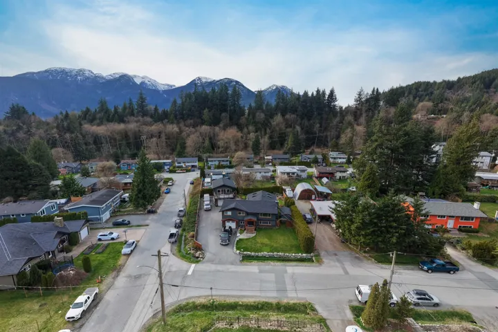 Aerial view highlighting a residential neighborhood with surrounding natural landscape
