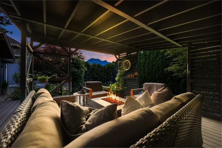 Covered outdoor living space featuring composite decking