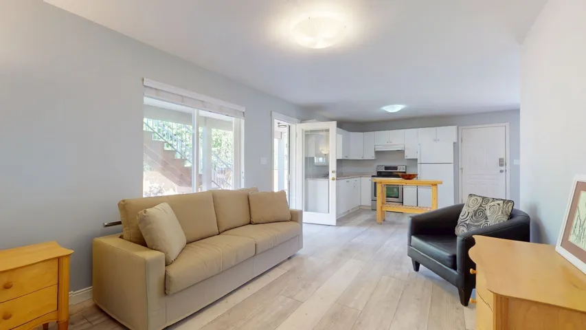 Living room with light wood finished floors and baseboards