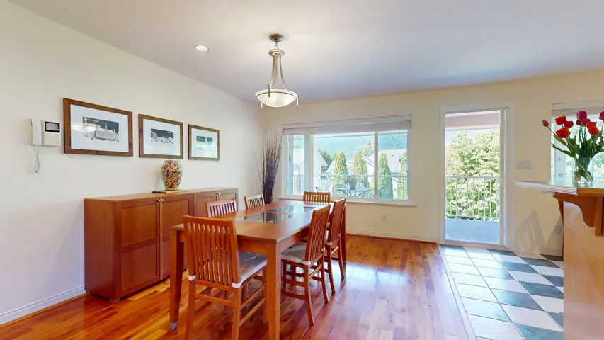 Dining space with baseboards and light wood finished floors