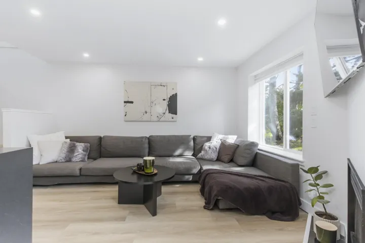 Interior space featuring recessed lighting, large-format window, and wood-finish flooring