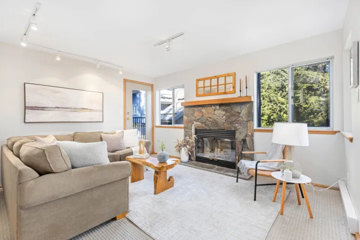 Living area with a stone fireplace