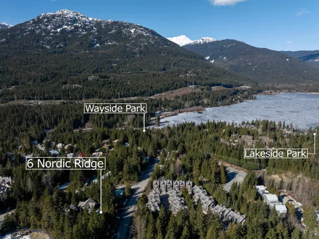 Property view of mountains with a view of trees and a water view
