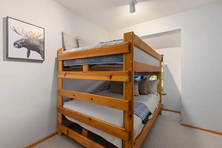 Bedroom featuring baseboards and carpet floors