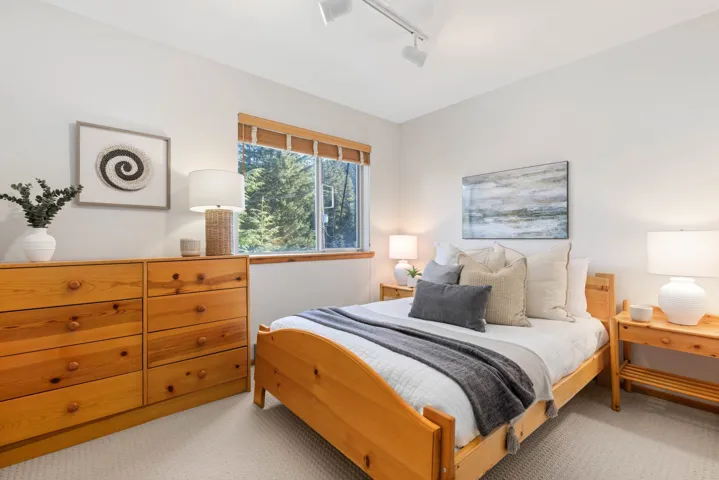 Carpeted bedroom with track lighting