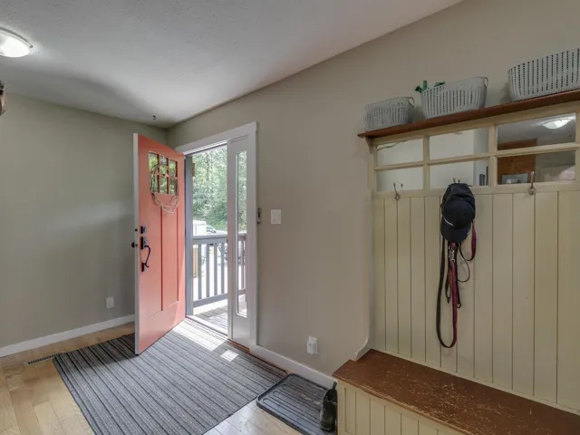 Foyer entrance featuring wood finished floors