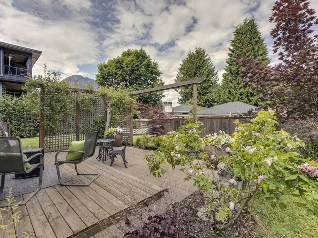 Backyard sundeck with a mountain view
