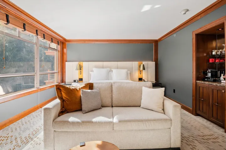 Carpeted bedroom featuring ornamental molding and baseboards