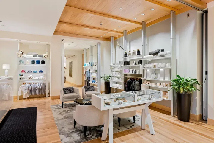 Living area with a wooden ceiling with exposed beams, light wood finished floors, built in features, and recessed lighting