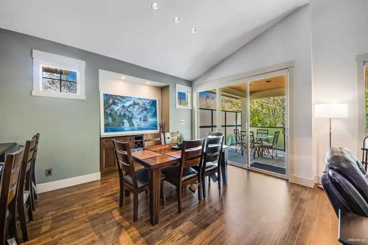 Dining area with recessed lighting, high vaulted ceiling, dark wood finished floors, and baseboards