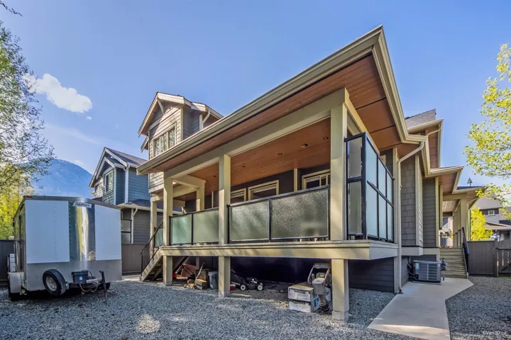 View of home's exterior featuring covered porch and cooling unit