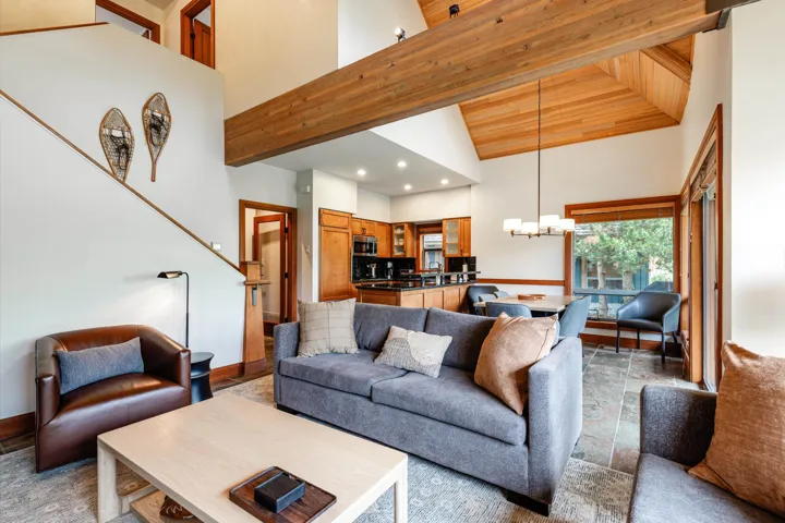 Vaulted ceilings featuring wood paneling and exposed beams