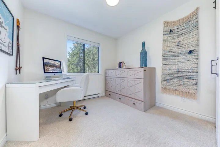 Office with light carpet and baseboards