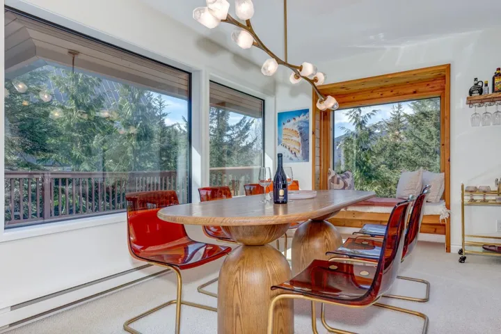 Carpeted dining area with baseboard heating