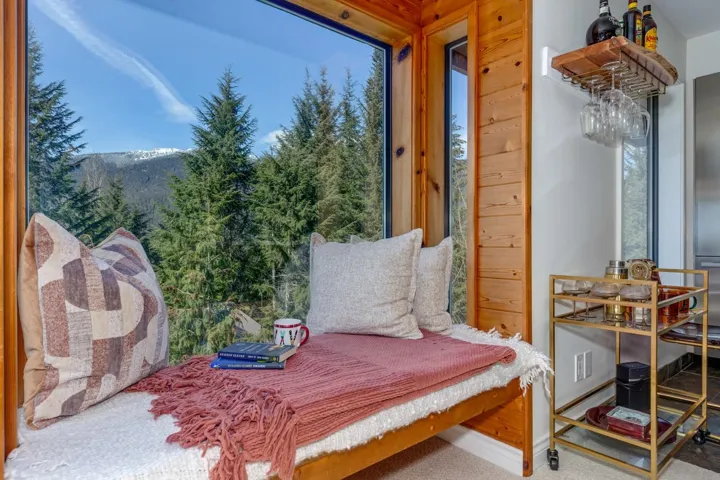 Bedroom with carpet and stainless steel refrigerator