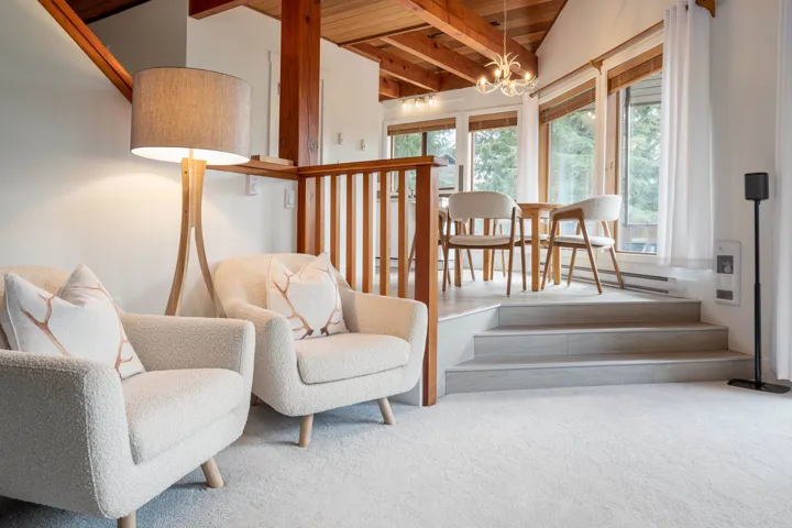 Large open floorplan living room with access to covered deck.