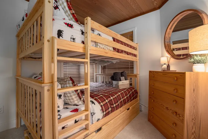 Sold furnished with bunk beds, a dresser, a mirror, and side tables!