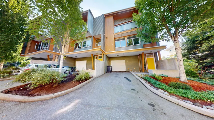 Contemporary home with an attached garage and driveway