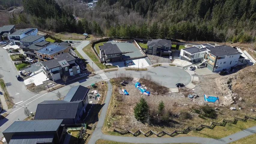 Birds eye view of property with a residential view and a view of trees