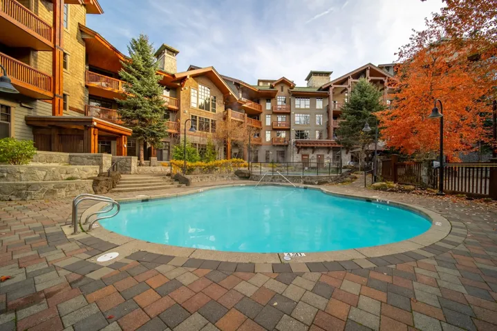 Community pool featuring a patio area