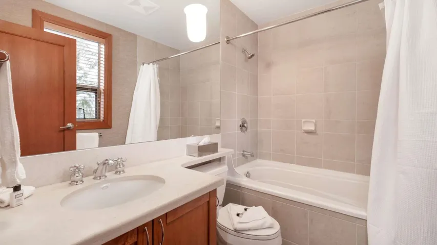 Upstairs ensuite bath for the second bedroom.