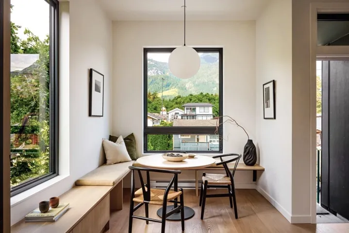 Light-filled corner with a built-in bench seating and storage cabinetry