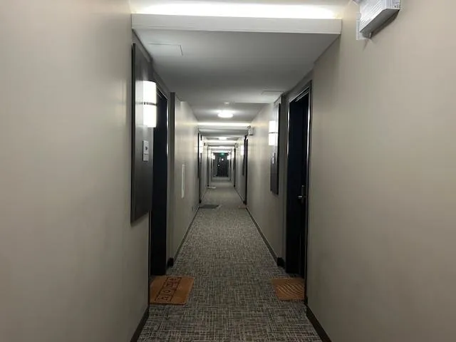 Hall featuring baseboards