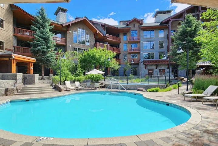 Community pool with a patio area