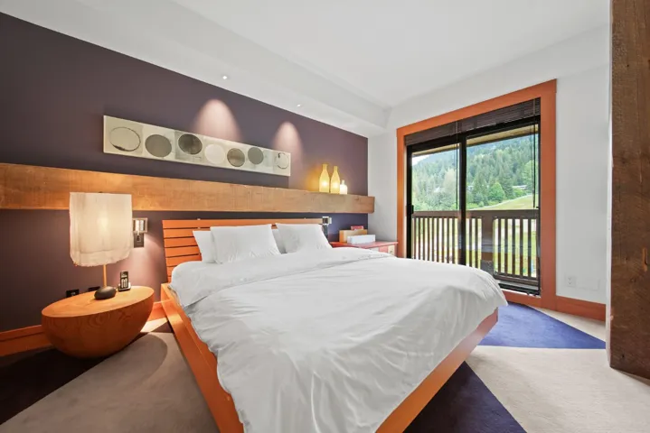 Bedroom with access to exterior and carpet