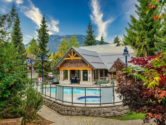 Community pool featuring a community hot tub, a patio area, and a mountain view