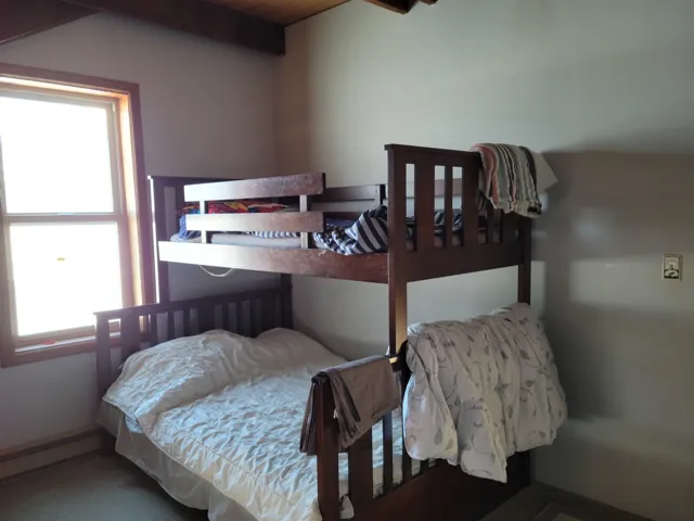 Bedroom featuring beamed ceiling
