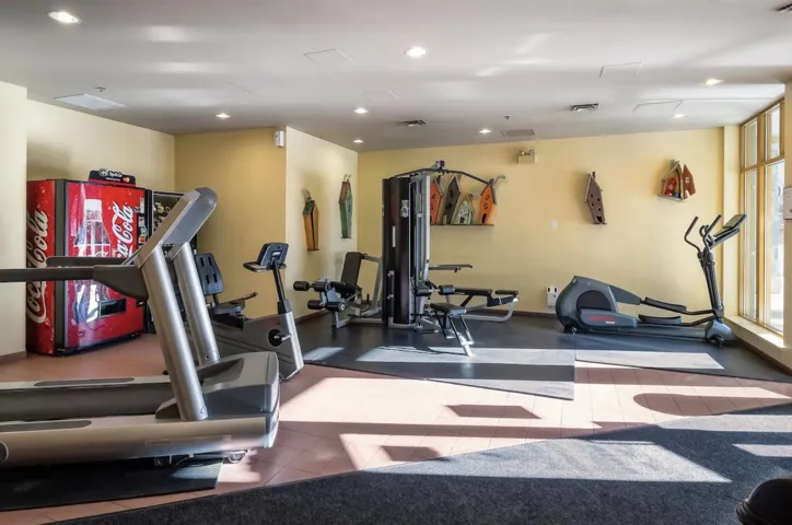 Workout area featuring recessed lighting
