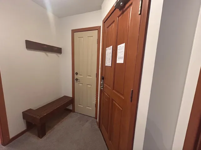 Entryway featuring carpet flooring
