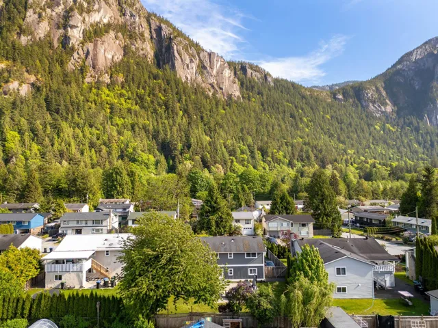 View of mountain backdrop with a forest and nearby suburban area