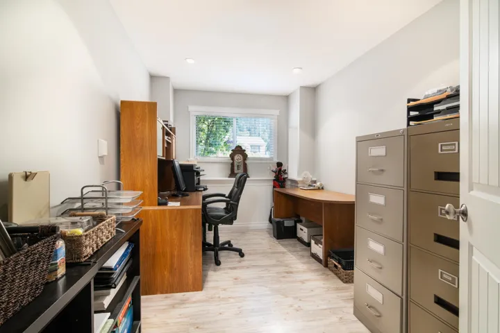 Office featuring light wood-style flooring and recessed lighting