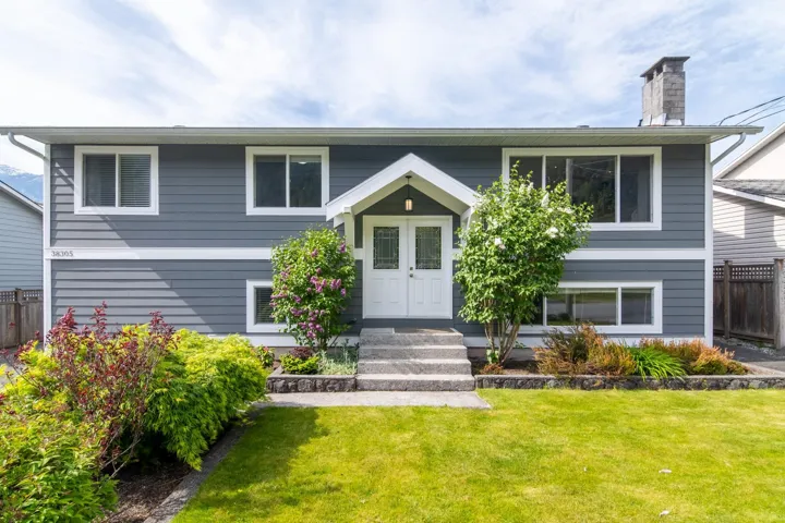 Split foyer home featuring a chimney