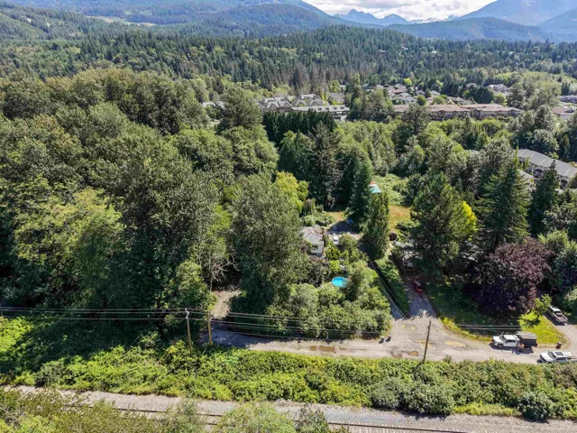 Secluded residential lot featuring mature trees and a partial mountain backdrop