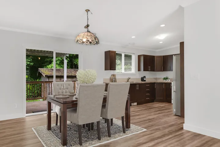Dining area featuring ornamental molding, plenty of natural light, baseboards, light wood-style flooring, and recessed lighting