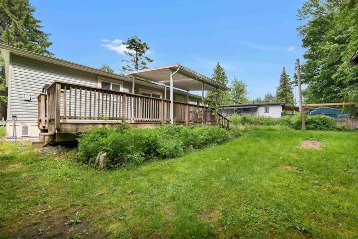 Rear view of house with a deck