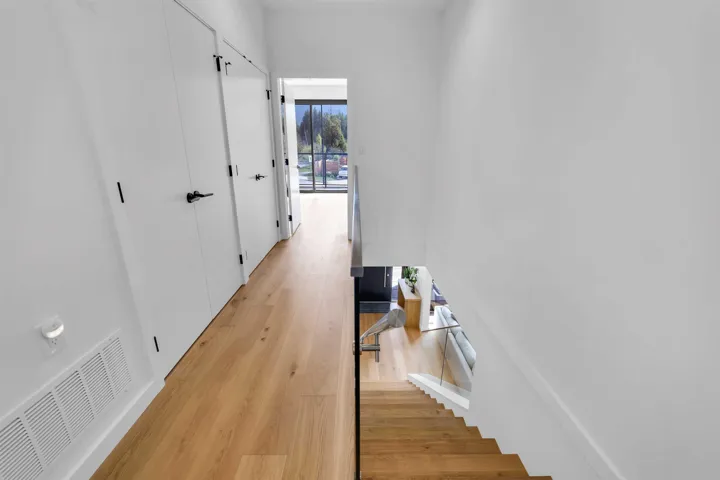 Hall featuring light wood-style flooring