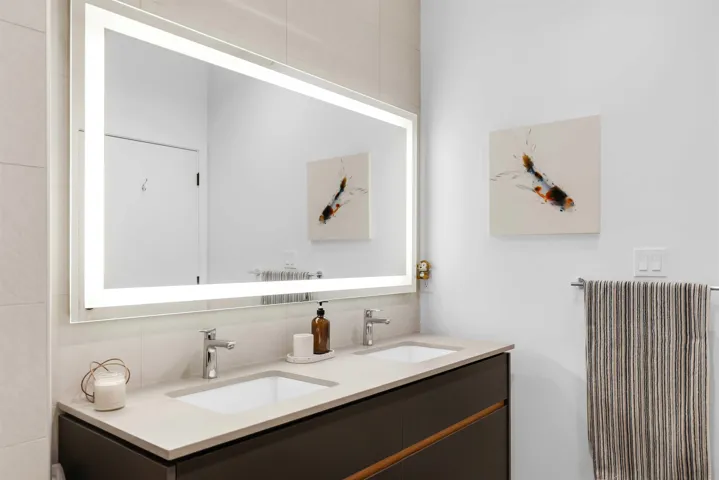 Full bath featuring double vanity